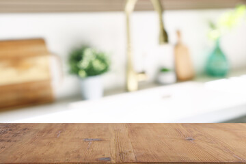 empty table board and defocused modern kitchen background. product display concept