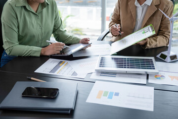 Business meeting for sustainable energy startup.