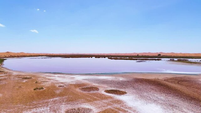Aerial establishing shot of Wulan Lake in the Tengger Desert in China