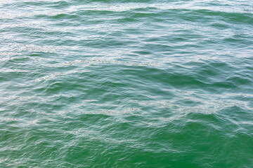 Fototapeta premium Turquoise water in the sea as an abstract background. Texture
