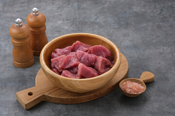 Fresh sliced raw beef (daging sapi), food preparation.
