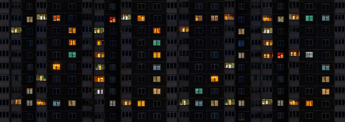 sign 2025 in flat night panorama of multicolor light in windows of multistory buildings as concept for new year