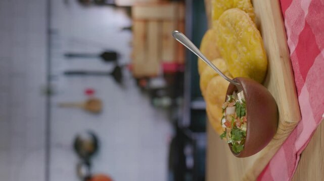 Sopaipillas and Pebre fiestas patrias Chile kitchen spoon taking