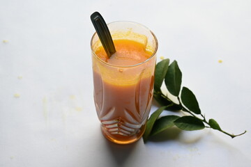 Fresh Orange juice on white background. It is a famous fruit juice which contains lots of vitamins like vitamin C, folate and potassium. Healthy drink. Fruit juice.
