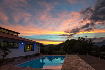 Beautiful Sunset over the Pool of a Country House - Itaipava, Rio de Janeiro, Brazil