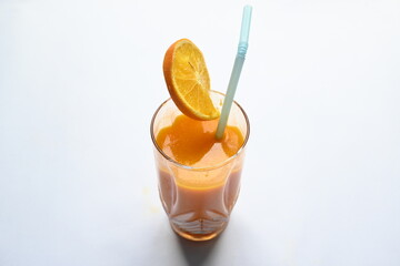 Fresh Orange juice on white background. It is a famous fruit juice which contains lots of vitamins like vitamin C, folate and potassium. Healthy drink. Fruit juice.

