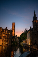 Fototapeta premium Medieval Bruges: Rozenhoedkaai and Belfry at Dusk - Belgium