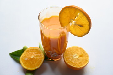 Fresh Orange juice on white background. It is a famous fruit juice which contains lots of vitamins like vitamin C, folate and potassium. Healthy drink. Fruit juice.
