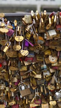 The Locks of Love Of Montmartre Paris. Huge amount of wedding symbols on bridge. 4K UHD. Vertical shot.