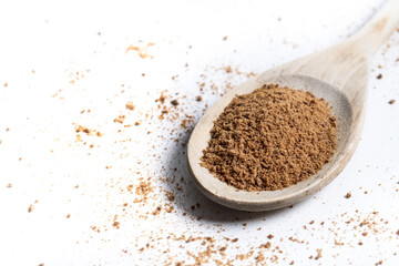 Coconut palm sugar on a wooden spoon isolated on white background. Copy space