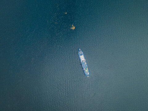 Aerial view of tranquil boat on clear water, Sooke, British Columbia, Canada.