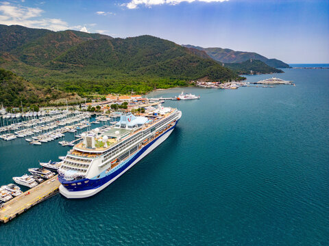 Marmaris, Turkey - 27 May 2024: Aerial view of marina, boats, and cruise ship in Marmaris, Mugla, Turkey.