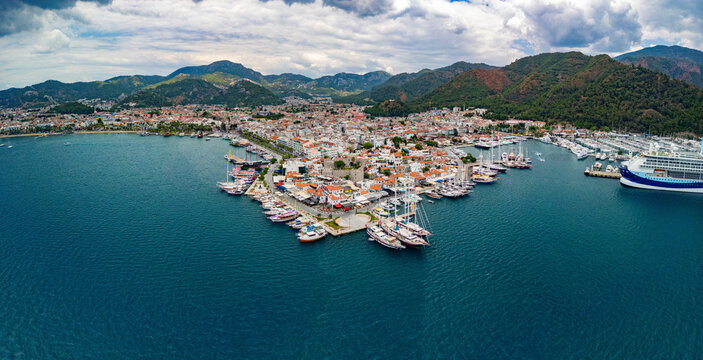 Aerial view of clear turquoise ocean with boats and castle, Marmaris, Mugla, Turkey.