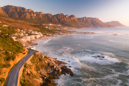 Aerial view of Bantry Bay coastline at sunset with 12 Apostles mountains, Cape Town, South Africa.