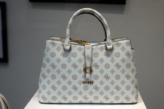 Mulhouse - France - 23 june 2024 - Closeup of white leather handbag with famous pattern by Gucci in a luxury fashion store showroom