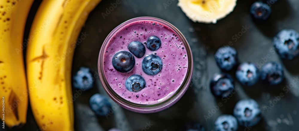 Aufkleber top view of a blueberry and banana smoothie in a glass jar, with a focus on healthy eating, copy spa