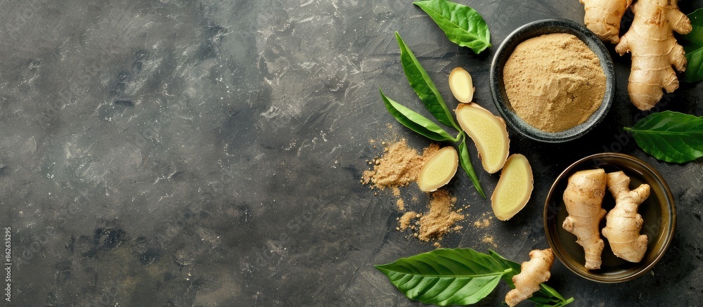 Sticker ginger powder, fresh root, and leaves displayed on a grey table in a flat lay composition, providing