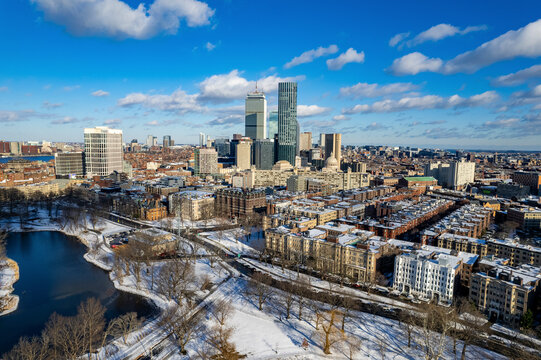 Aerial view of snow-covered Fenway Park with lake and urban landscape, Boston, Massachusetts, United States. - Powered by Adobe