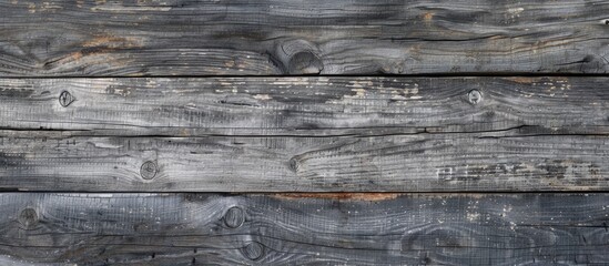 Fototapeta premium Sunlit gray textured aged wood creates a natural background for motivational quotes and graphics with a copy space image application.
