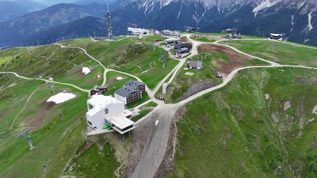 right panning aerial video landscape view of Kronplatz summit, located in South Tyrol in norther Italy with one of six Messner Mountain Museum and Lumen - Museum of mountain photography - footage 
