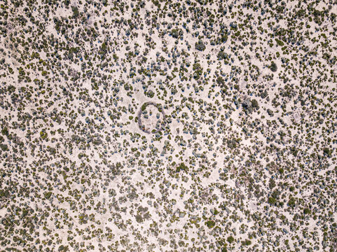 Aerial view of barren terrain with sparse vegetation in Vezo region, Enclosure, Anakao, Madagascar.
