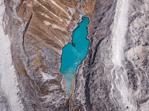Aerial view of turquoise water lake, glacier, and mountain in Rolwaling valley, Dudh Pokhari lake, Rolwaling glacier, Gauri Sankar, Bagmati, Nepal.