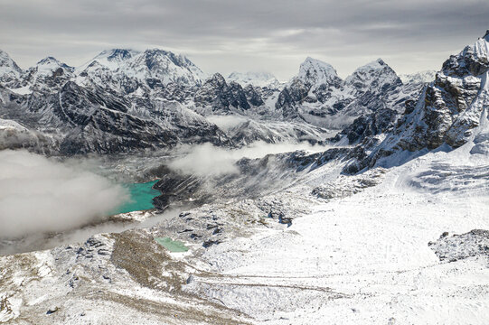 Aerial view of snowy mountains and Gokyo lake with Cholatse, Taboche, and Arakam tse mountains, Khumjung, Province no 1, Nepal.