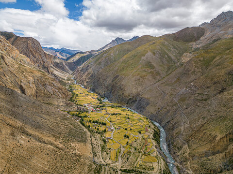 Aerial view of Majestic Himalayan Mountains and Serene Valley with Tora Khola River, Shimen Village, Dolpa, Nepal.