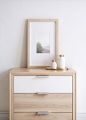 A clean and modern interior mockup featuring a blank wooden frame on a natural wood dresser. Perfect for showcasing artwork, prints, or photography in a stylish and contemporary setting.