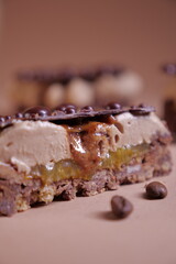 delicious dessert with chocolate cream, hazelnut praline and coffee. crispy base and chocolate decor. tasty pastry tart. modern dessert. layers. european confectionery
