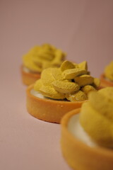 elegant shortcrust pastry tarts. cream flower. matcha flavor. green decor. pastry, desserts and sweets. modern european confectionery