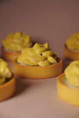 elegant shortcrust pastry tarts. cream flower. matcha flavor. green decor. pastry, desserts and sweets. modern european confectionery