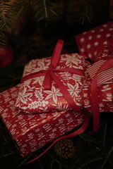christmas and new year holidays. magical atmosphere. packaging and ribbons for gifts. beautiful boxes and things are packed under the Christmas tree.