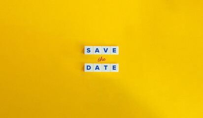 Save the Date Concept Image. Block Letter Tiles on Yellow Background. Minimal Aesthetics.