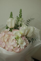 girly, cute, tender, beautiful bouquet. green, white and pink flowers. tulip, ranunculus, hydrangea, eucalyptus branches