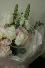 girly, cute, tender, beautiful bouquet. green, white and pink flowers. tulip, ranunculus, hydrangea, eucalyptus branches