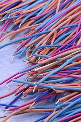 Copper stranded mounting electrical wires in colored insulation for electrical equipment. Close-up. Soft focus.