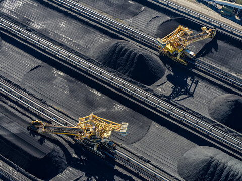 Aerial view of industrial coal exports with machinery and conveyor belts at Kooragang, Newcastle, New South Wales, Australia.