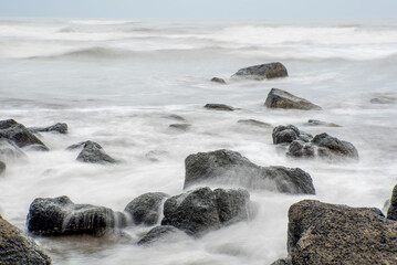 Wild rocky beach or Seascape with powerful waves, Maharashtra, India, Asia.