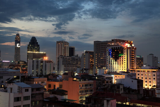 View of illuminated Bangkok skyline at night, Phra Nakhon, Thailand.