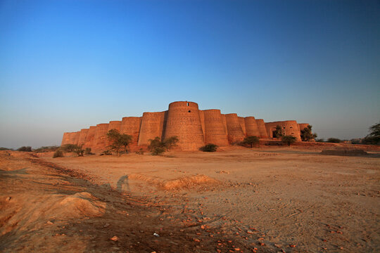 View of Multan Fort at sunset in desert landscape, Multan, Pakistan.