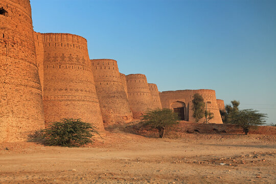 View of Multan Fort at sunset with brick walls and trees, Multan, Pakistan.