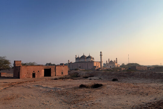 View of Multan Fort at sunset with ancient ruins and minaret, Multan, Pakistan.