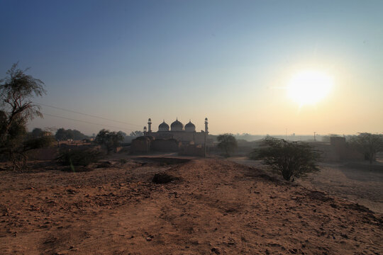 View of Multan Fort at sunset with ancient temple and historical building, Multan, Punjab, Pakistan.