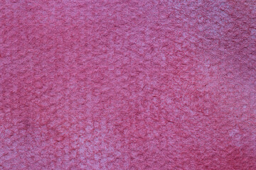 grunge background: close up of textured paper stained with purple paint