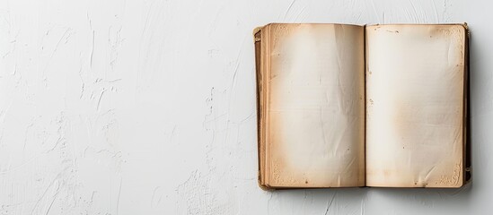 Unveil diary on a blank white backdrop with copy space image.