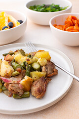 Stewed duck fillet with potatoes and asparagus and radishes, mixed salad of various greens, baked carrots in tahini sauce, orange and blueberry for dessert, healthy delicious breakfasts or lunches