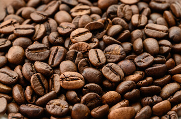 Roasted coffee beans on dark background. Selective focus.
