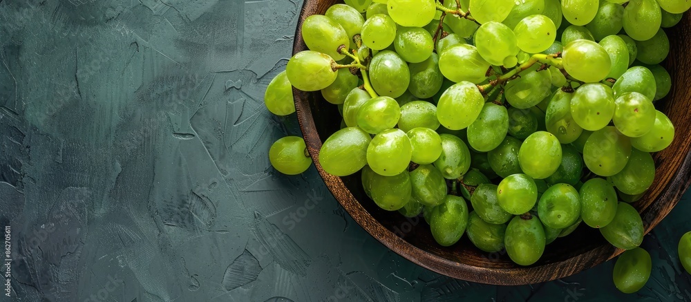 Poster close-up top view of ripe, big, beautiful green grapes with a mix of sweet and sour flavors, making 