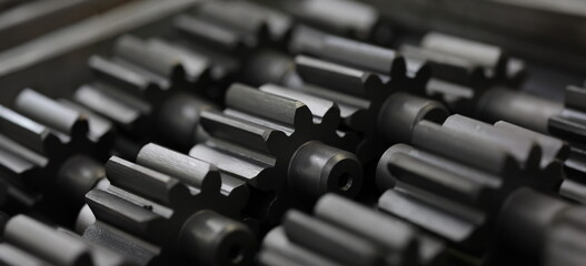Obraz premium Lot of black metal parts lying on table closeup. Sale of auto parts concept
